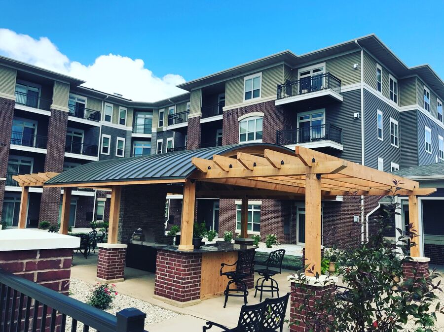 The Abbey apartments courtyard with covered pergola and seating