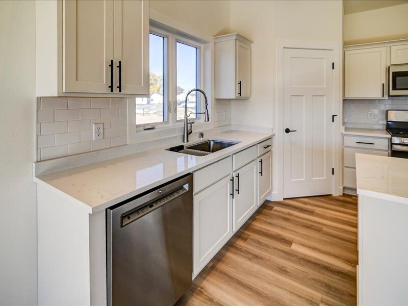 White kitchen with farmhouse-style sink