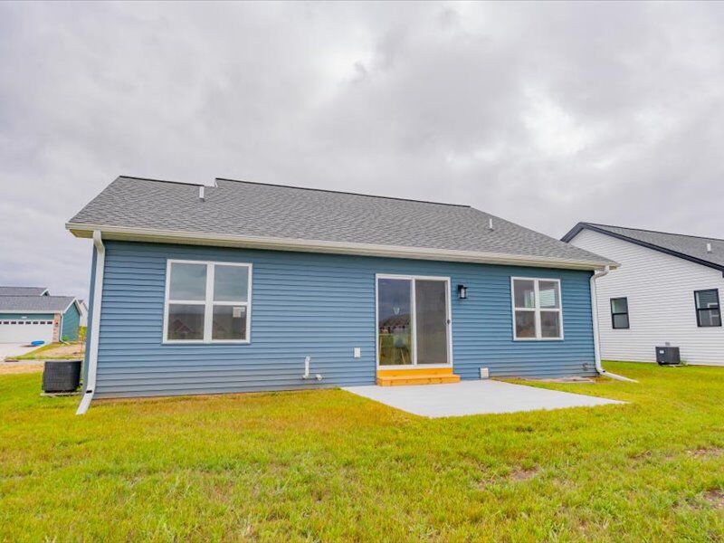 Back of the home with patio