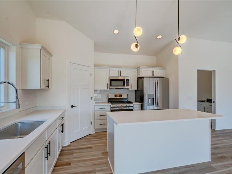 White kitchen with large island
