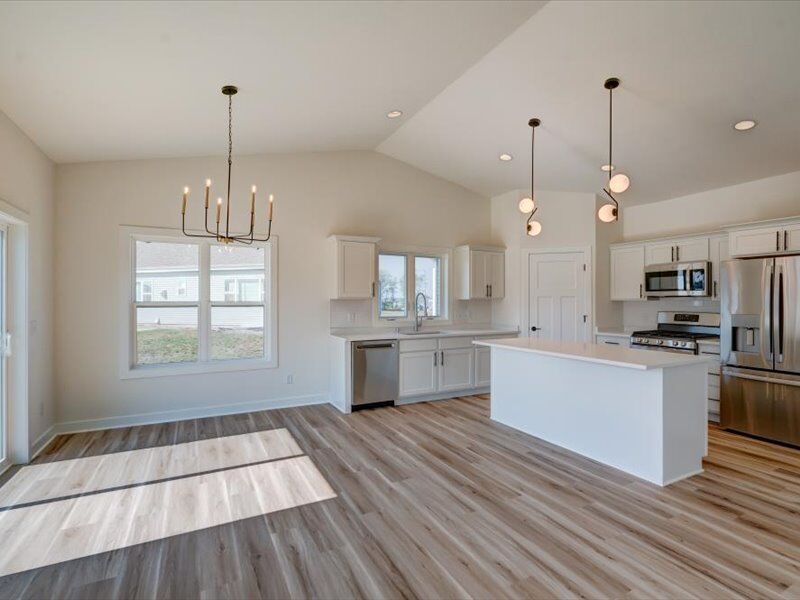 Great room and kitchen with chandelier